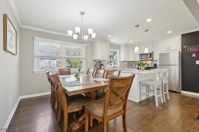 dining room with crown molding, baseboards, recessed lighting, dark wood-type flooring, and a chandelier