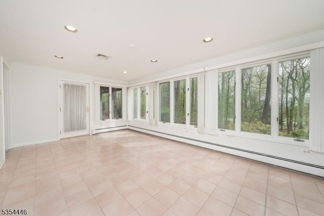 unfurnished sunroom featuring visible vents and baseboard heating