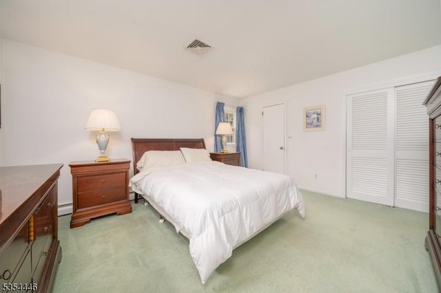 bedroom featuring visible vents, a baseboard radiator, and light carpet