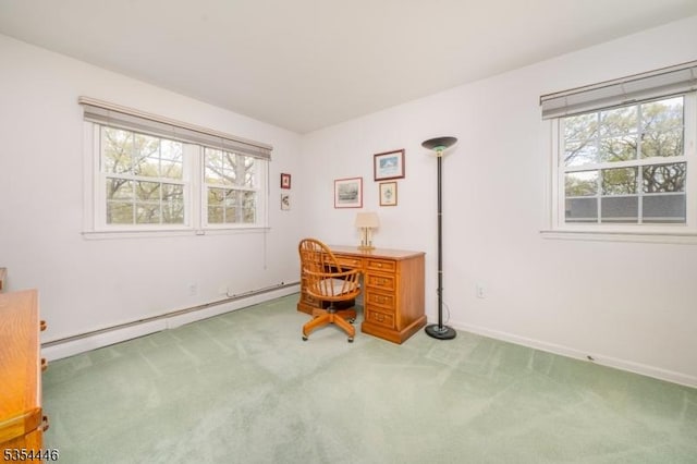 office area featuring baseboards, a baseboard radiator, carpet, and a healthy amount of sunlight