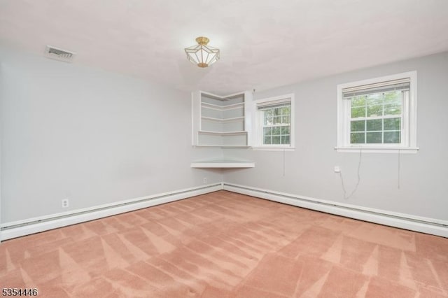 unfurnished room with carpet flooring, visible vents, and baseboard heating