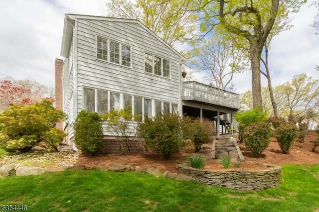 rear view of house with a deck