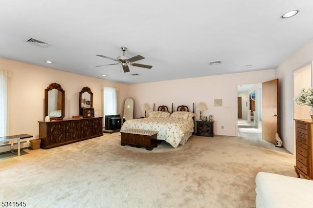 bedroom with recessed lighting, visible vents, and light carpet
