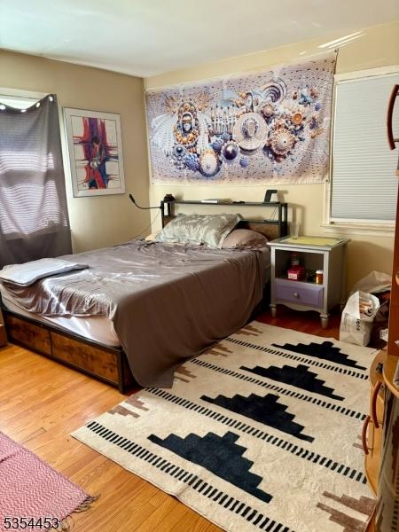 bedroom with wood finished floors