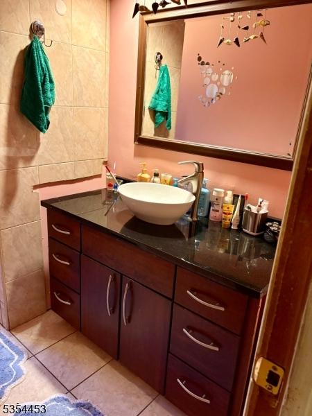 bathroom with vanity and tile patterned flooring