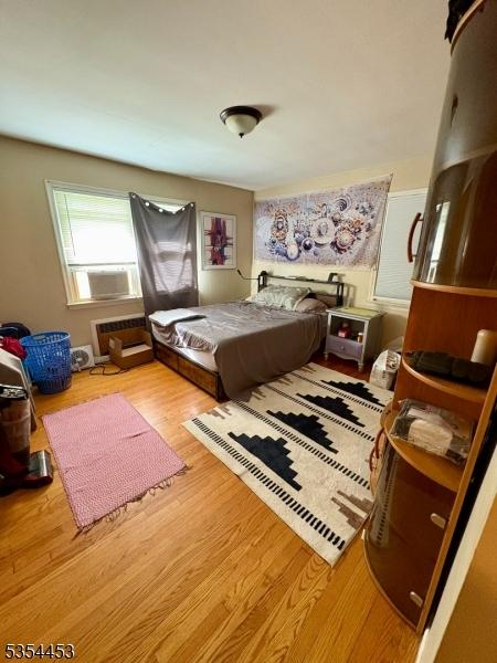 bedroom featuring wood finished floors