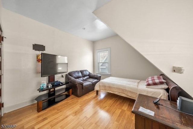 104 Riggs Pl, West Orange Twp, NJ 07052 - bedroom with light wood-style floors, baseboards, and vaulted ceiling