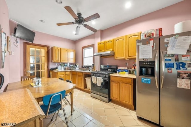 104 Riggs Pl, West Orange Twp, NJ 07052 - kitchen with light tile patterned flooring, ceiling fan, under cabinet range hood, a sink, and appliances with stainless steel finishes