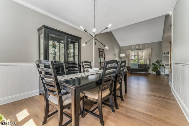 18 Higgins Farm Rd, Delaware Twp, NJ 08559 - dining area featuring a notable chandelier, wainscoting, wood finished floors, and lofted ceiling