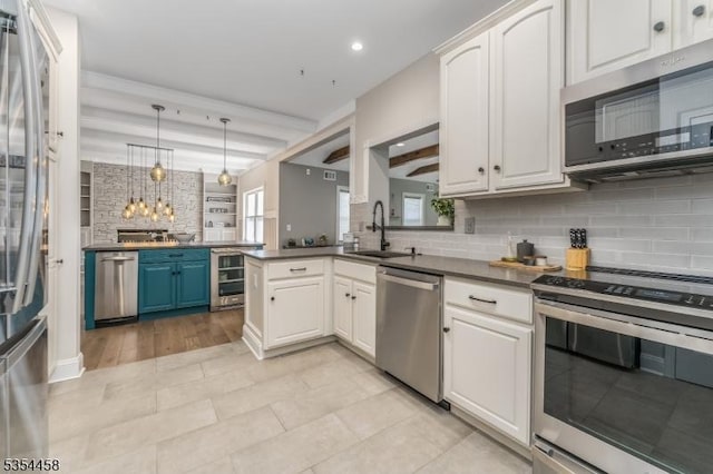 18 Higgins Farm Rd, Delaware Twp, NJ 08559 - kitchen featuring a sink, decorative backsplash, a healthy amount of sunlight, and stainless steel appliances