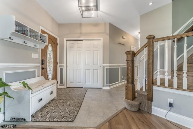 18 Higgins Farm Rd, Delaware Twp, NJ 08559 - entrance foyer with stairway, a decorative wall, and wainscoting