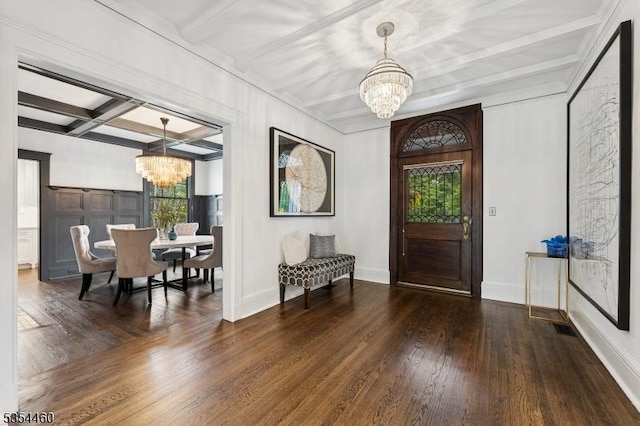 foyer entrance featuring a chandelier, coffered ceiling, wood finished floors, beamed ceiling, and baseboards