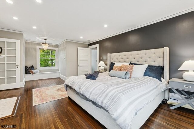 bedroom featuring ornamental molding, wood finished floors, baseboards, and recessed lighting