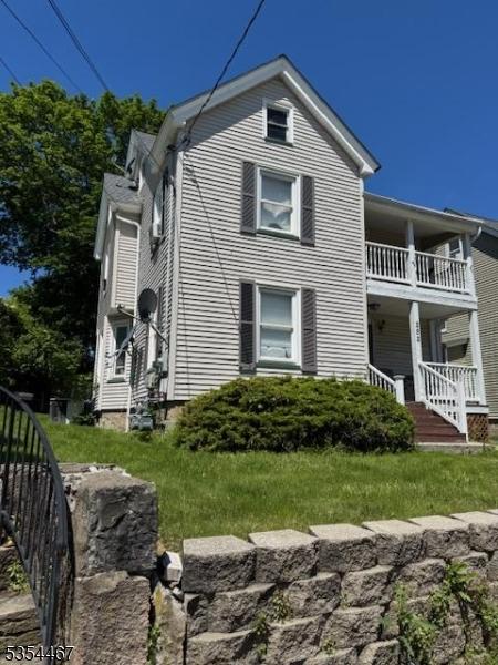 252 Spring St, Newton Town, NJ 07860 - view of property exterior featuring a balcony and a porch