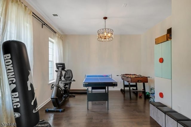 playroom with visible vents, baseboards, a chandelier, and dark wood-style floors