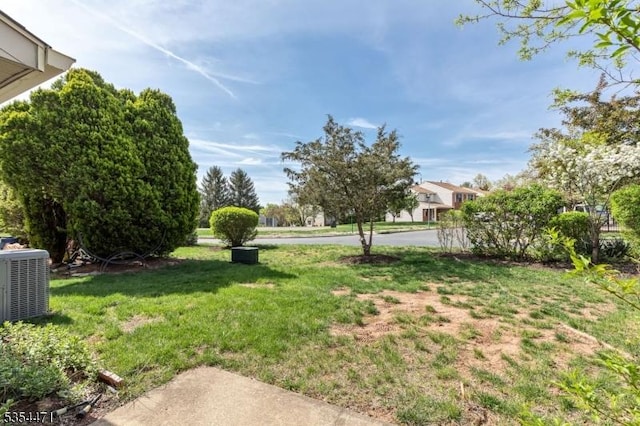 view of yard featuring central AC unit