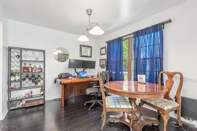home office with baseboards and wood finished floors