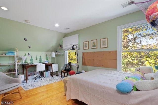 bedroom featuring recessed lighting, visible vents, wood finished floors, and lofted ceiling