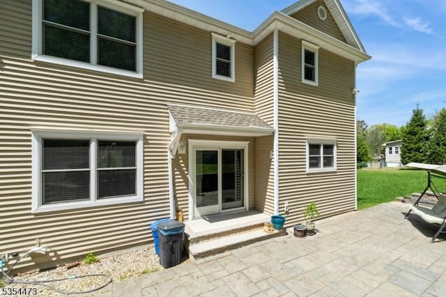 back of property featuring a patio