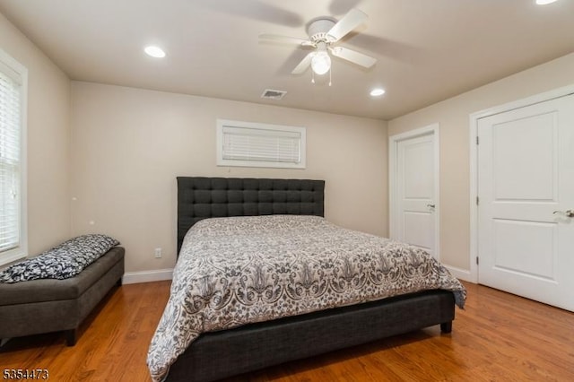bedroom with visible vents, recessed lighting, light wood finished floors, and baseboards