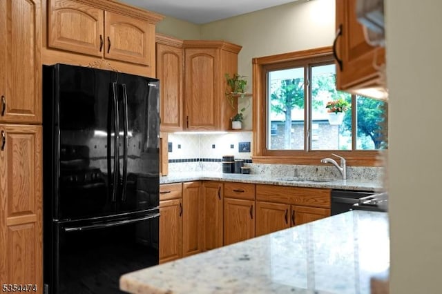 8 Katherine St, Denville Twp, NJ 07834 - kitchen with black appliances, backsplash, and light stone countertops