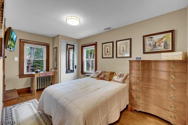 8 Katherine St, Denville Twp, NJ 07834 - bedroom featuring radiator and light wood-type flooring