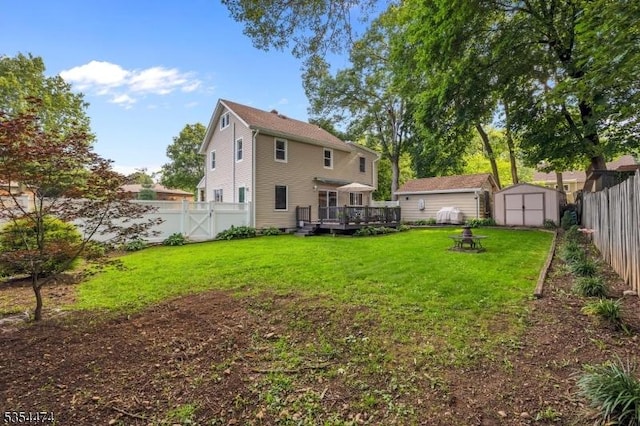 8 Katherine St, Denville Twp, NJ 07834 - back of property with a shed, a deck, and a fenced backyard