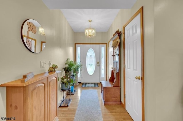 8 Katherine St, Denville Twp, NJ 07834 - entryway with light wood-type flooring and a chandelier