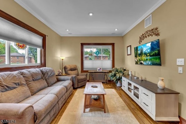 8 Katherine St, Denville Twp, NJ 07834 - living area with plenty of natural light, light wood-type flooring, crown molding, radiator heating unit, and recessed lighting