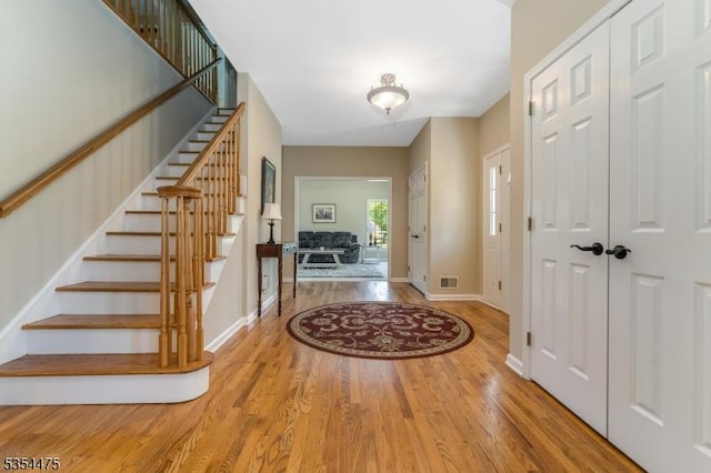 11 Southgate Dr, Clinton Twp, NJ 08801 - foyer entrance featuring stairway, baseboards, visible vents, and wood finished floors