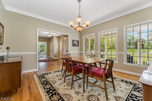 11 Southgate Dr, Clinton Twp, NJ 08801 - dining room featuring ornamental molding, a healthy amount of sunlight, and an inviting chandelier