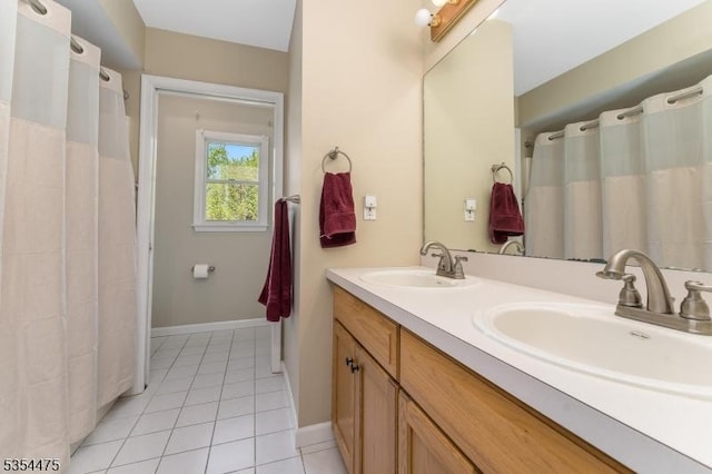 11 Southgate Dr, Clinton Twp, NJ 08801 - bathroom featuring baseboards, tile patterned floors, double vanity, and a sink