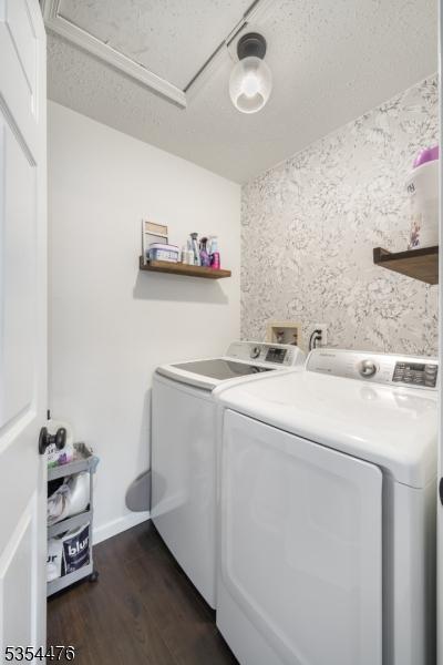 laundry room featuring laundry area, baseboards, dark wood-style flooring, and washing machine and dryer