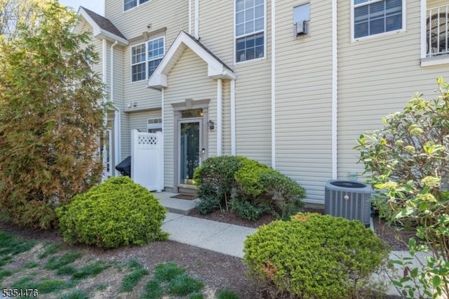 property entrance with central AC unit