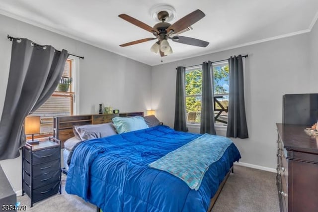 carpeted bedroom featuring baseboards, a ceiling fan, and multiple windows