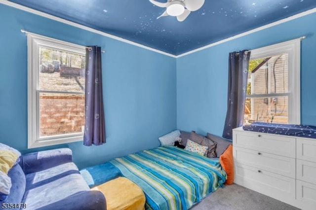 carpeted bedroom featuring a ceiling fan