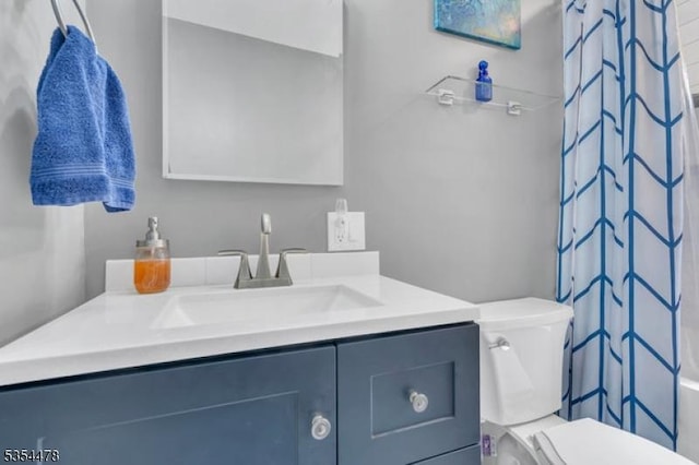 full bathroom featuring toilet and vanity
