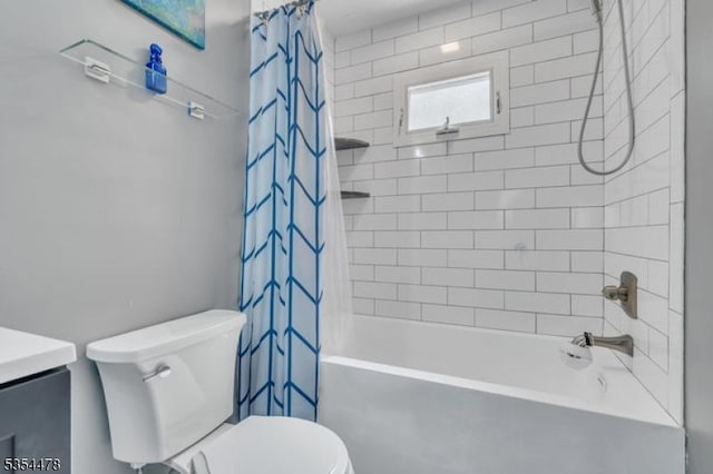 full bath with vanity, shower / tub combo, and toilet