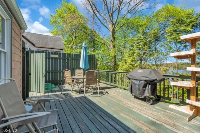 deck with outdoor dining area