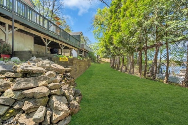 view of yard featuring a wooden deck