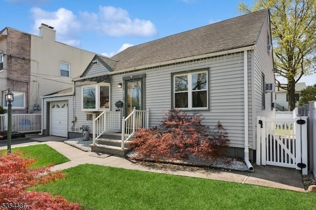 view of front of house with fence, a gate, and roof with shingles