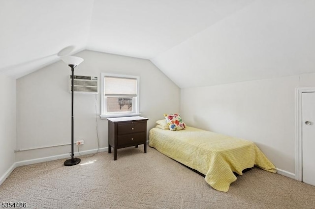 carpeted bedroom featuring baseboards, vaulted ceiling, and a wall mounted AC
