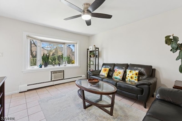 living room featuring baseboards, ceiling fan, light tile patterned floors, and a baseboard radiator