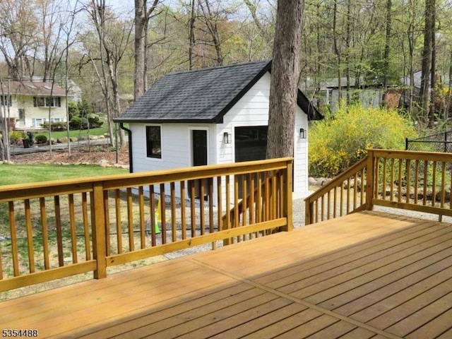 wooden deck featuring an outbuilding