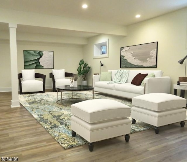 living room featuring recessed lighting, baseboards, and wood finished floors