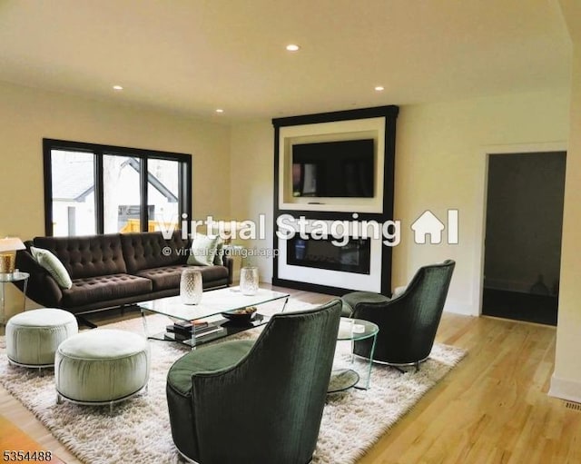 living room featuring recessed lighting and light wood finished floors