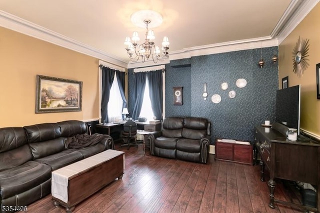 living room with ornamental molding, a chandelier, and hardwood / wood-style floors