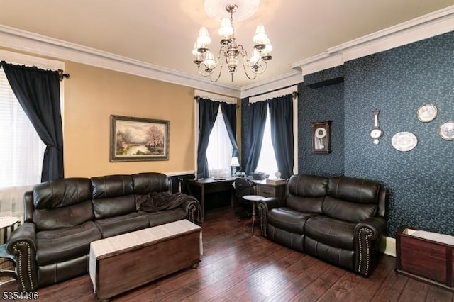 living area with an inviting chandelier, crown molding, wallpapered walls, and hardwood / wood-style floors