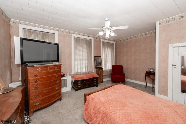 bedroom with carpet floors and a ceiling fan