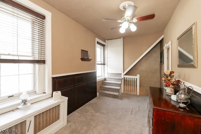 interior space featuring stairs and light colored carpet
